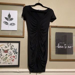 Black tight dress, ruched at front.